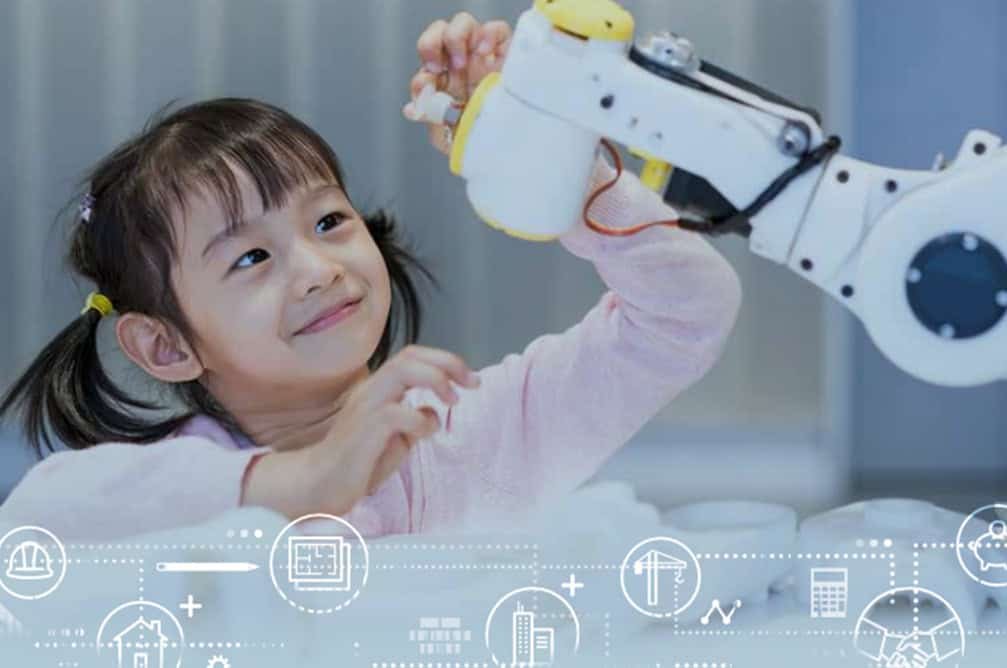 Little girl playing with a robot arm