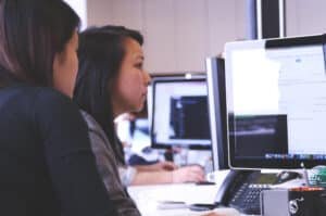 Two women working on a computer